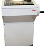 Leica laboratory slide stainer with touchscreen interface for medical and laboratory use.